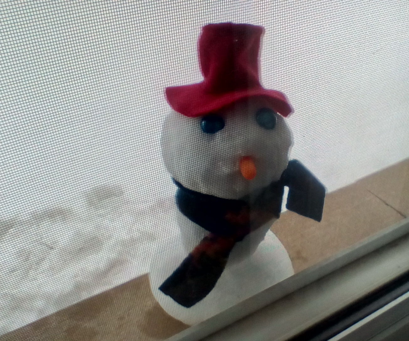 Mini Snowman in the Window